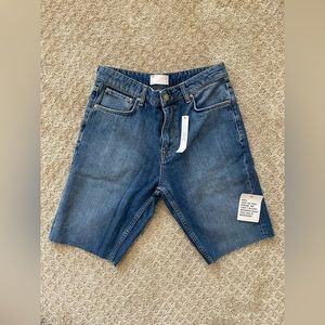 ASOS Designs denim dad short in mid wash with raw hem